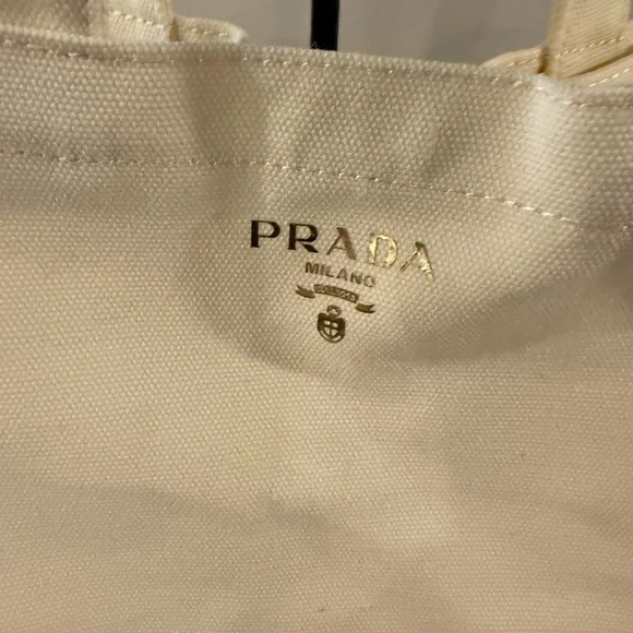 Cream-colored Prada Parfums novelty tote bag. Gift With Purchase - Picture 2 of 5